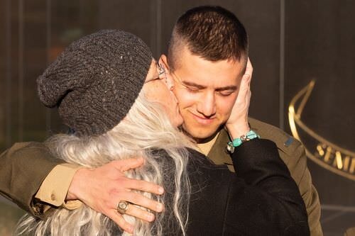 US Marine Corps War Memorial Ceremony mother kissing her son