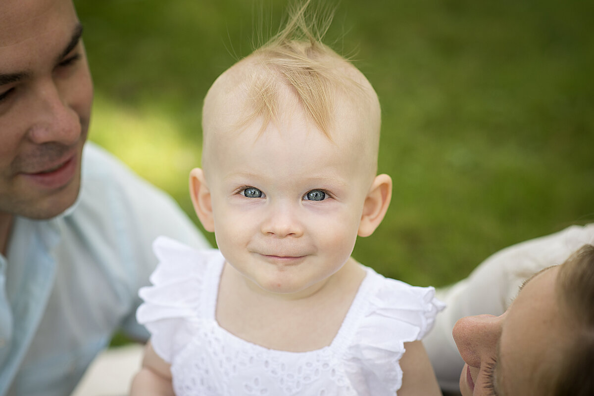 Perfect hair with bright eyes, 1 year old in white dress family session