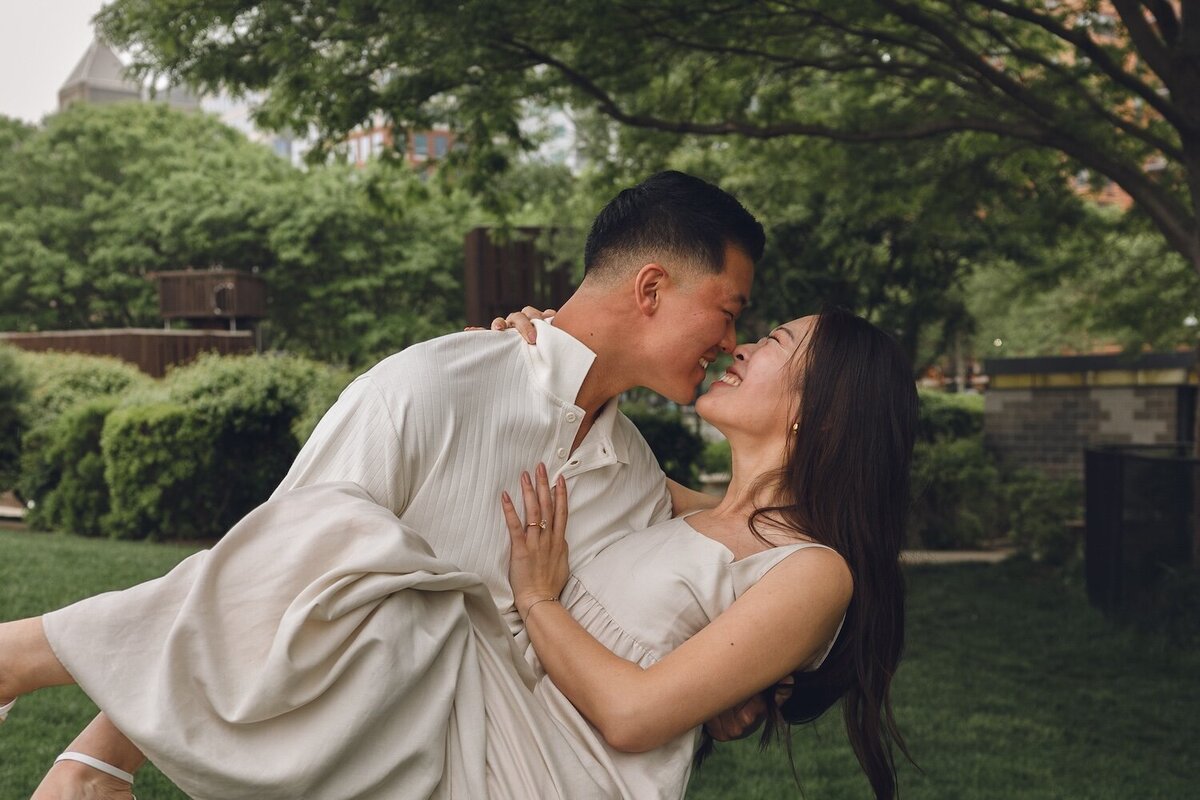 Intimate waterfront moment with skyline in the background