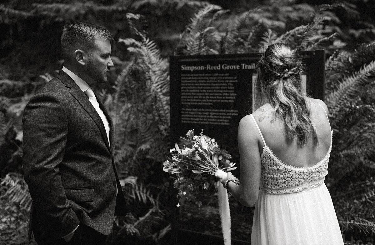 Couple reading trail details on their wedding day