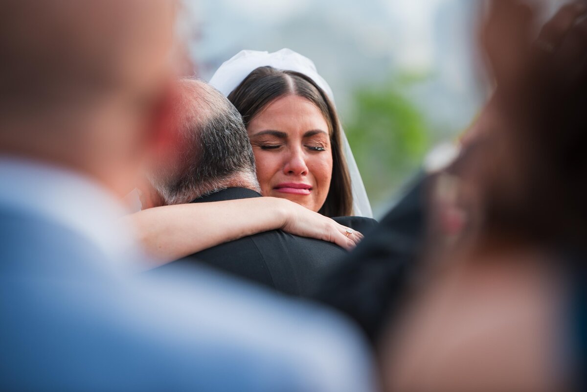 The Motas -bride and dad hug