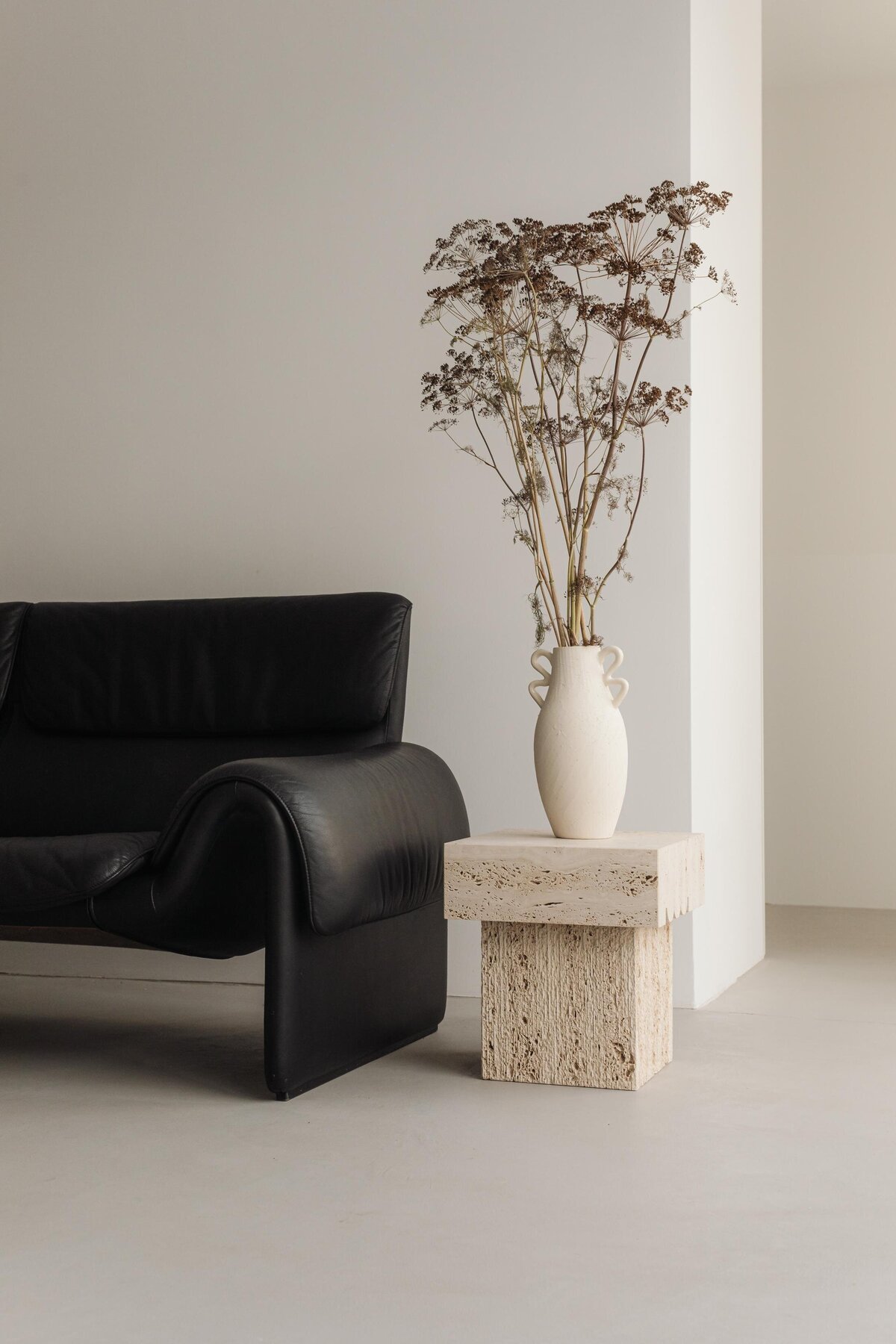 kaboompics_interior-inspo-warm-minimalist-living-room-de-sede-ds-2011-leather-sofa-and-travertine-furniture-36559