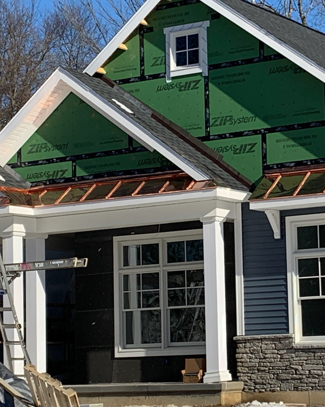 New build with copper roofing on the awnings