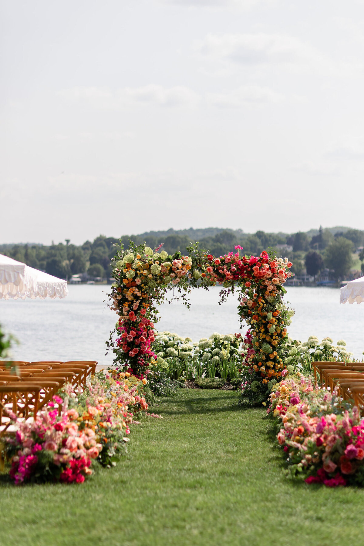 Colorful Vibrant Pink Yellow Orange Wedding Chuppah and Aisle Flowers - Flowerwell - Verve Event Co. - (1