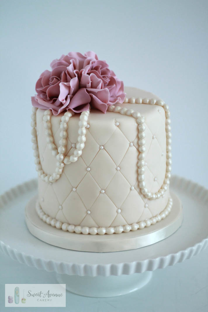 vintage birthday cake with pearls and blush roses