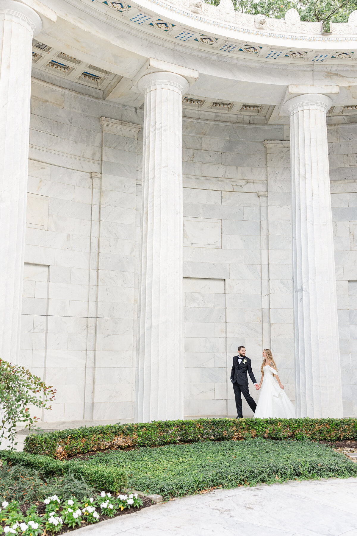 Bride & Groom walking hand in hand McKinley Memorial Museum Wedding Niles OH