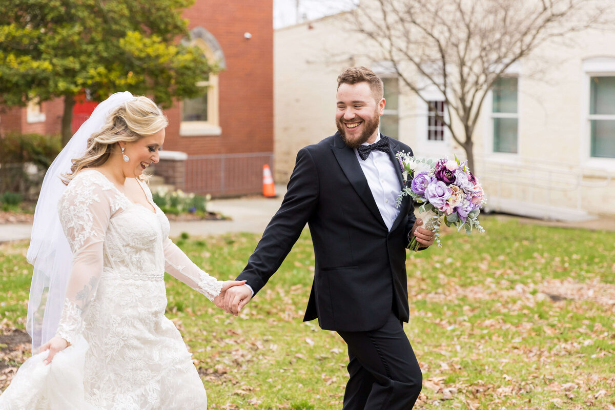 Bride and groom walking along at wedding at The Gatsby in Shelbyville,KY