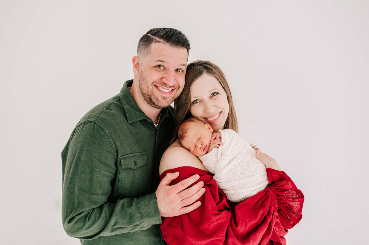 newborn pictures in Branson of parents holding baby boy