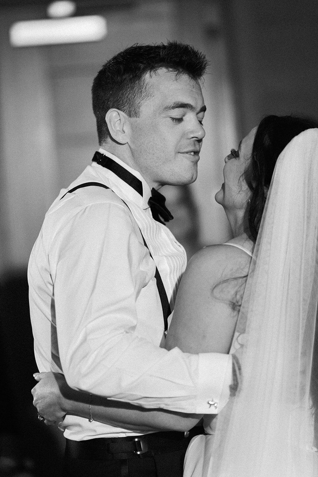 The bride and groom share a heartfelt first dance, with soft lighting creating a romantic ambiance at Ocean Reef, Key Largo.