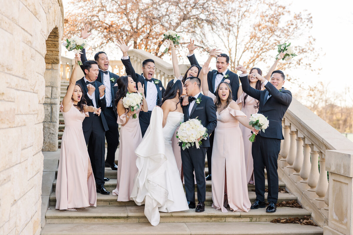 wedding-party-on-steps-at-a-luxurious-mansion