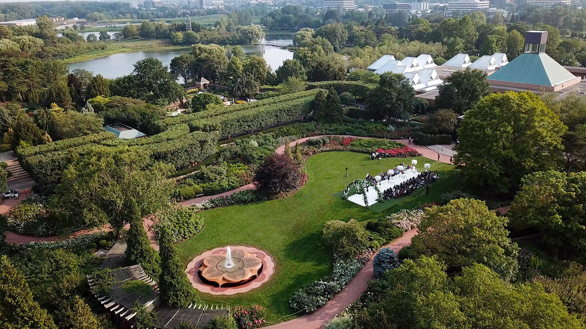 Aerial view of the wedding setup in a lush garden.