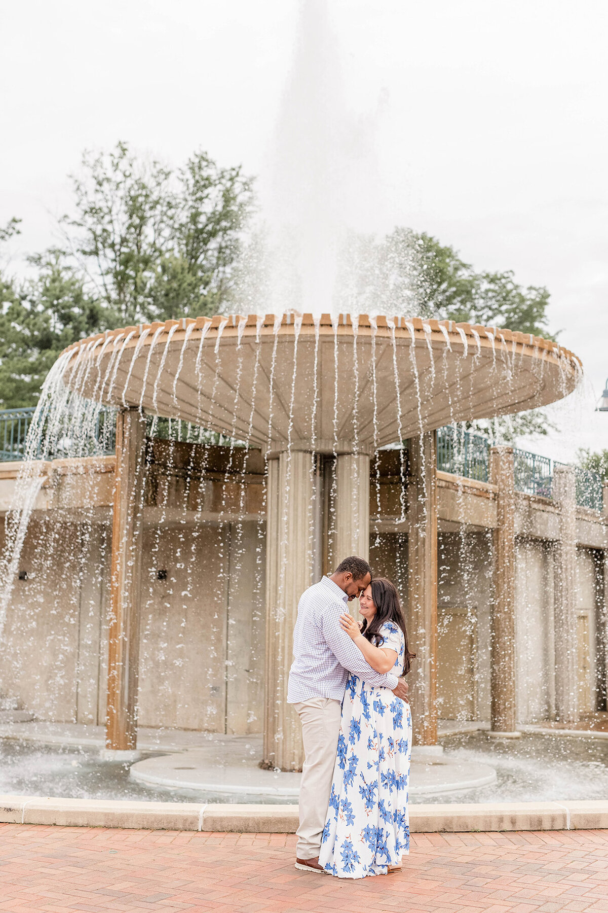 Engagement Portraits taken by a  water fountain