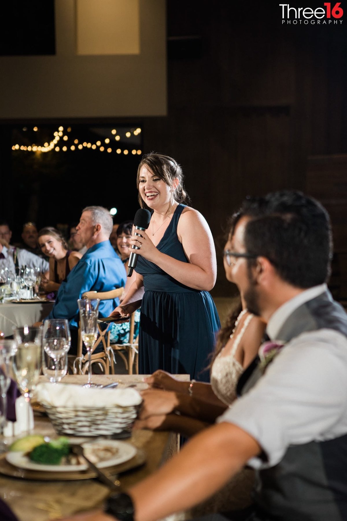 Maid of Honor toasts the new couple