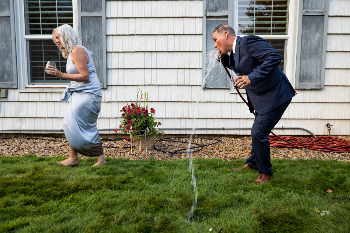 wedding-parents-mud-drink-hose-kellogg