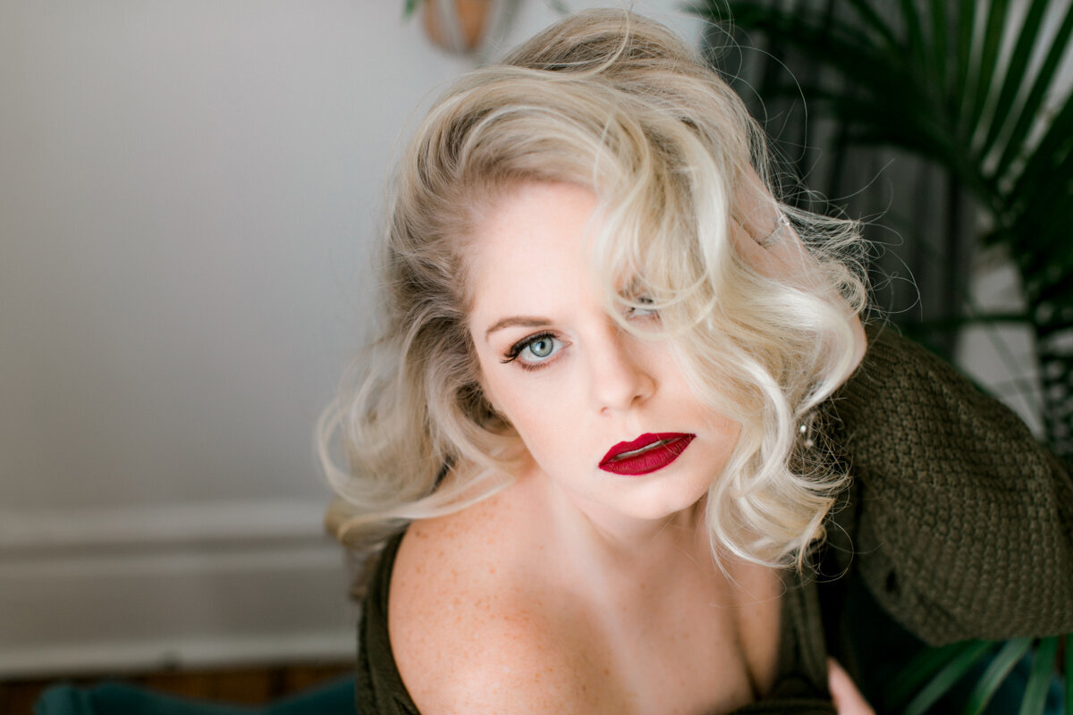 woman with green eyes and bold red lip
