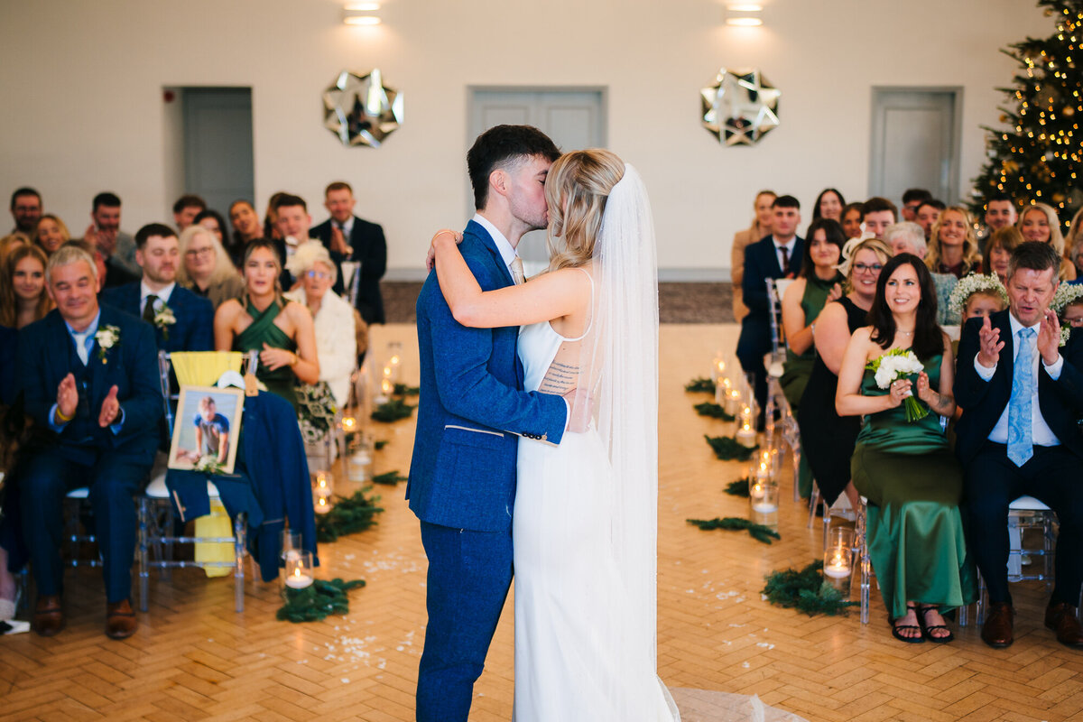Wide shot of Bride and groom kissing fore the first time as husband and wife at Mytton Fold Hotel taken by Anthony Horseman wedding photographer