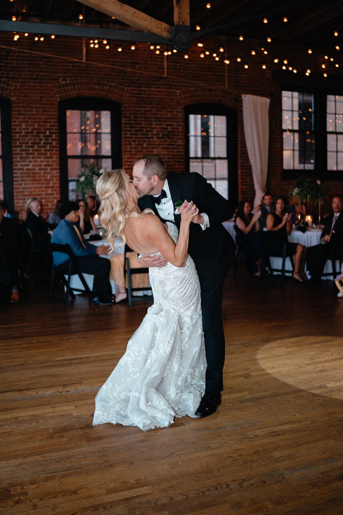 Bride and Groom kiss on the dancefloor of their wedding reception