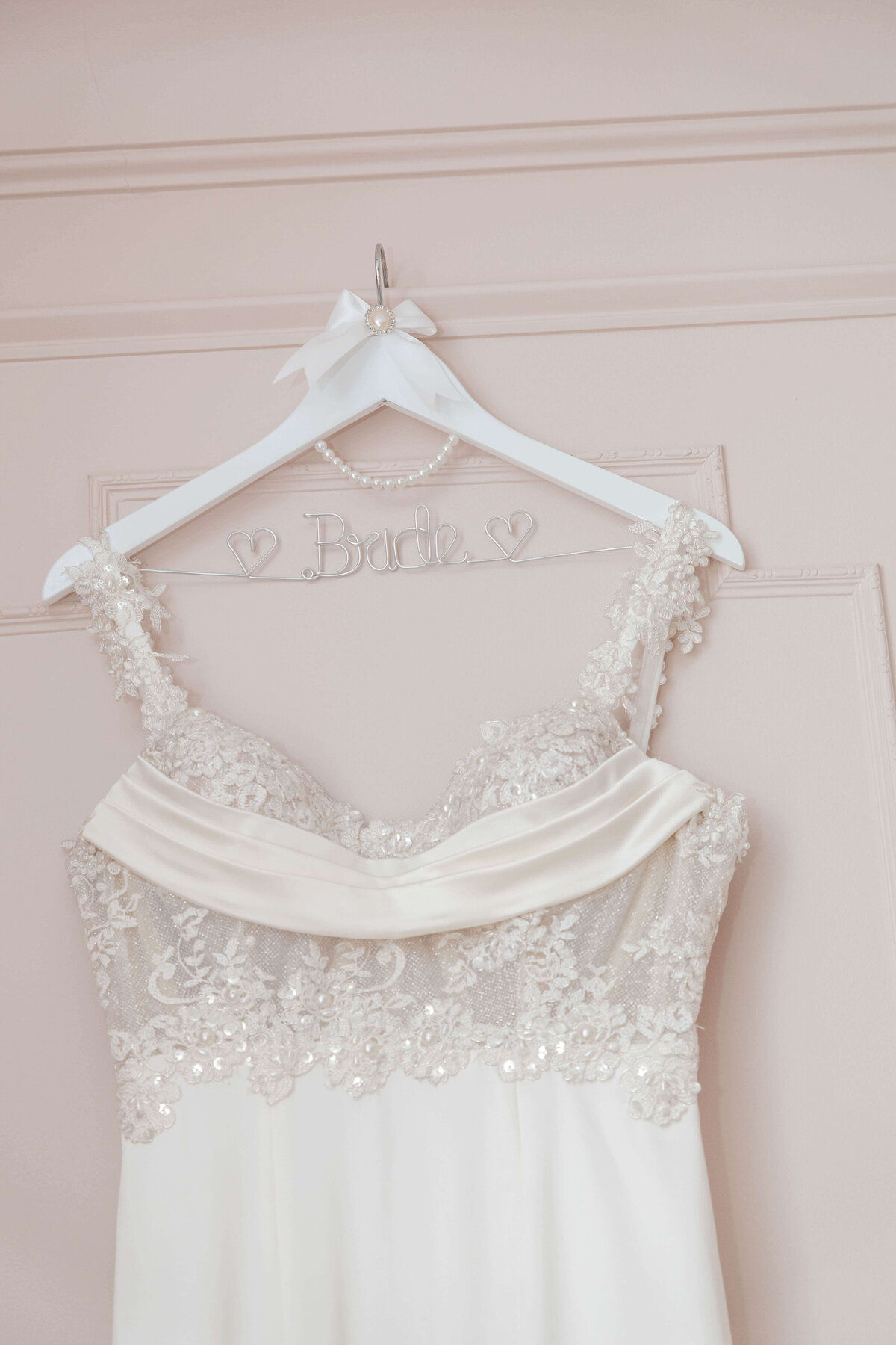 Intricate lace detailing on the bodice of a luxurious wedding gown.