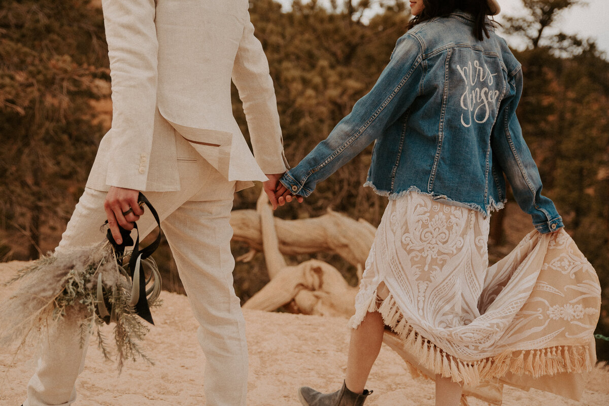 Jean jacket and wide brimmed hat elopement inspiration. Edgy and boho wedding look.