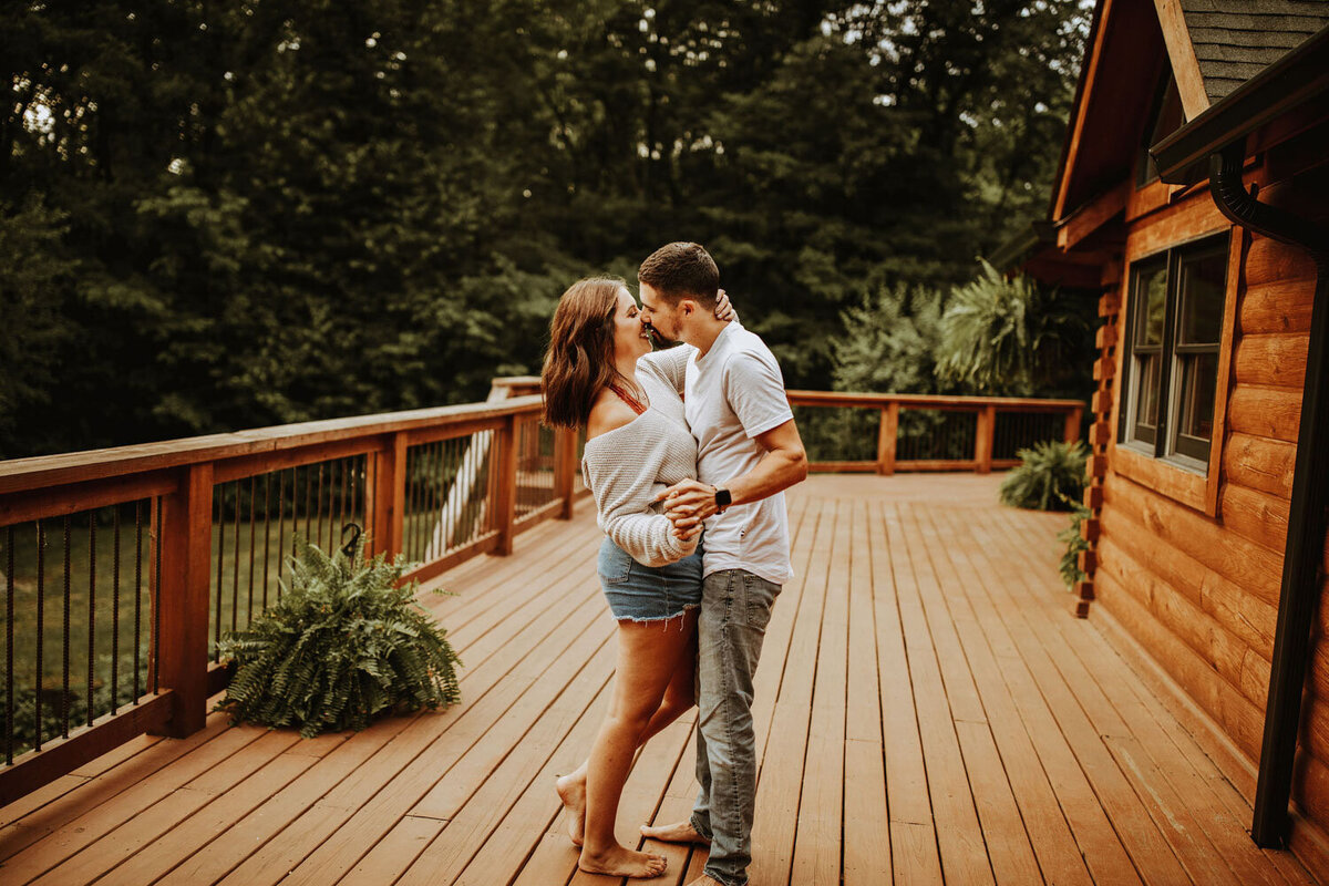 A cozy couple's moment on a wooden deck surrounded by nature