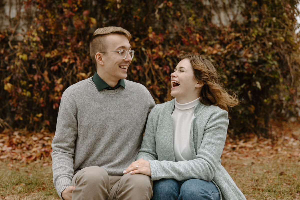 fall laughing couple