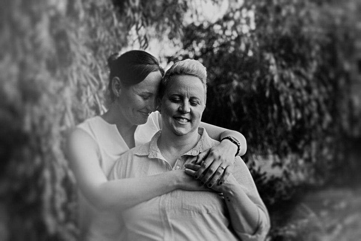 black-and-white-image-of-an-lgbtq-engaged-couple-sharing-a-moment-at-patterson-park-in-ottawa-1