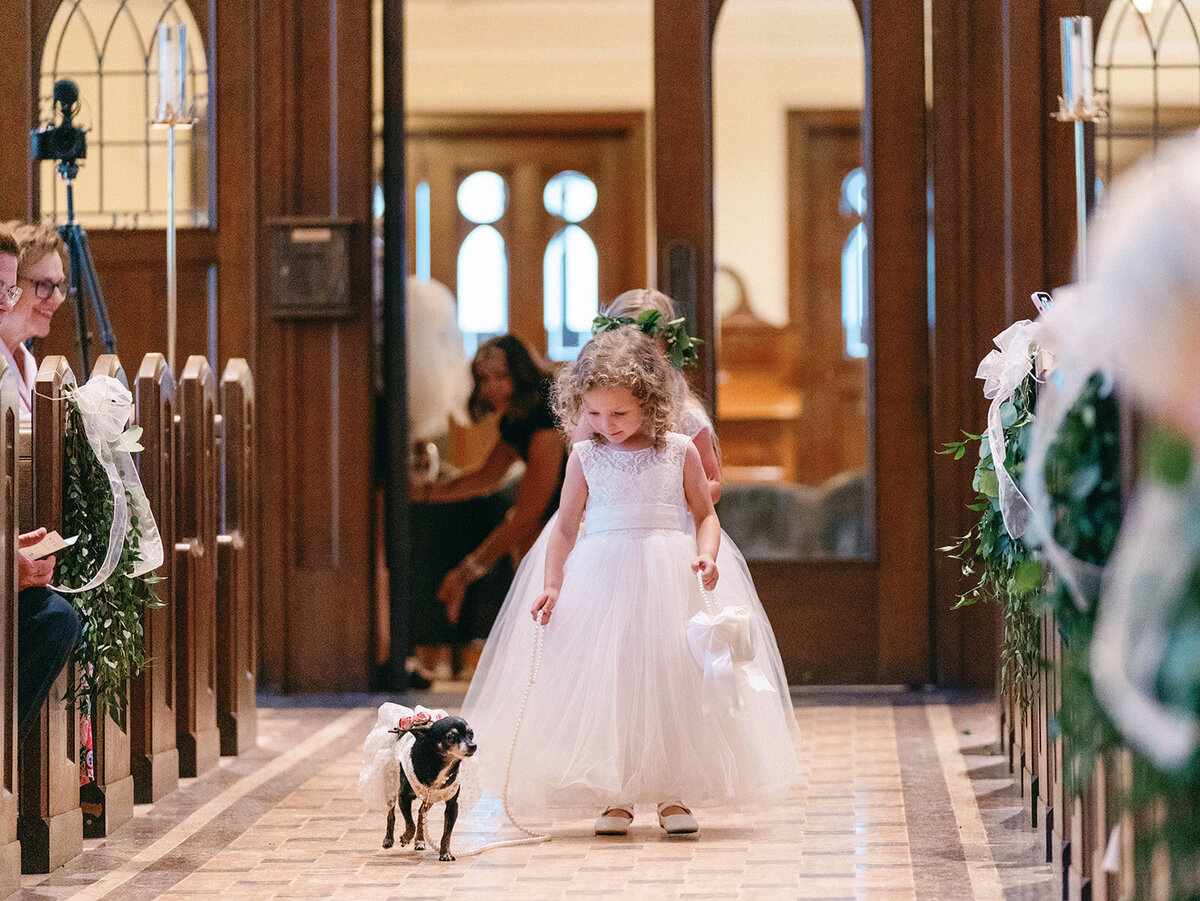 Flowergirl with a ring bearer dog at Memorial Presbyterian Church in St. Louis