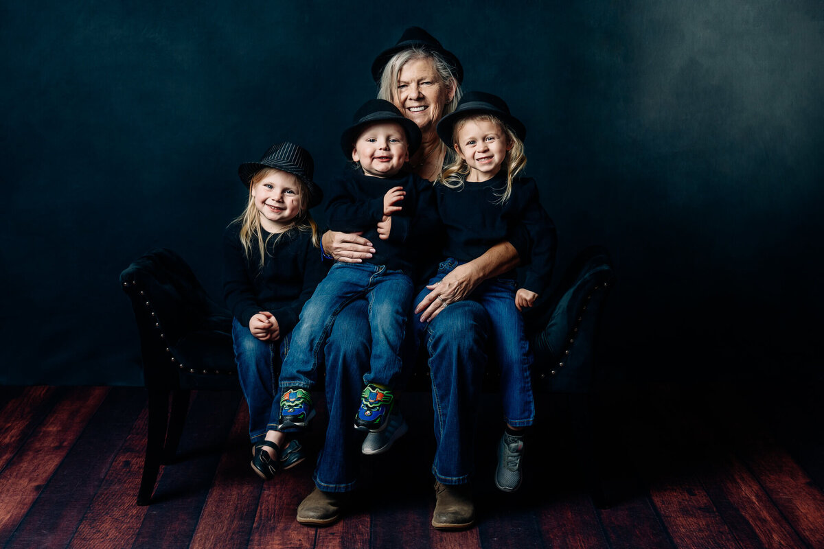 Grandmother poses with kids in Prescott family photography studio
