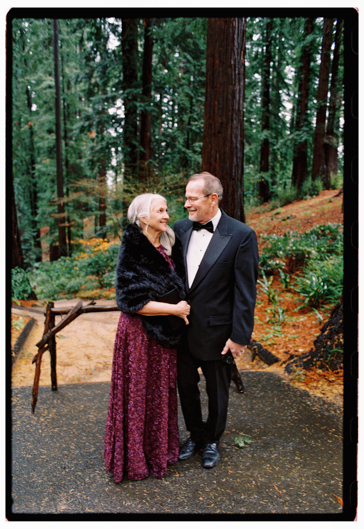 Emotional moment at the wedding as an older couple lovingly looks at one another captured by Kate Winters