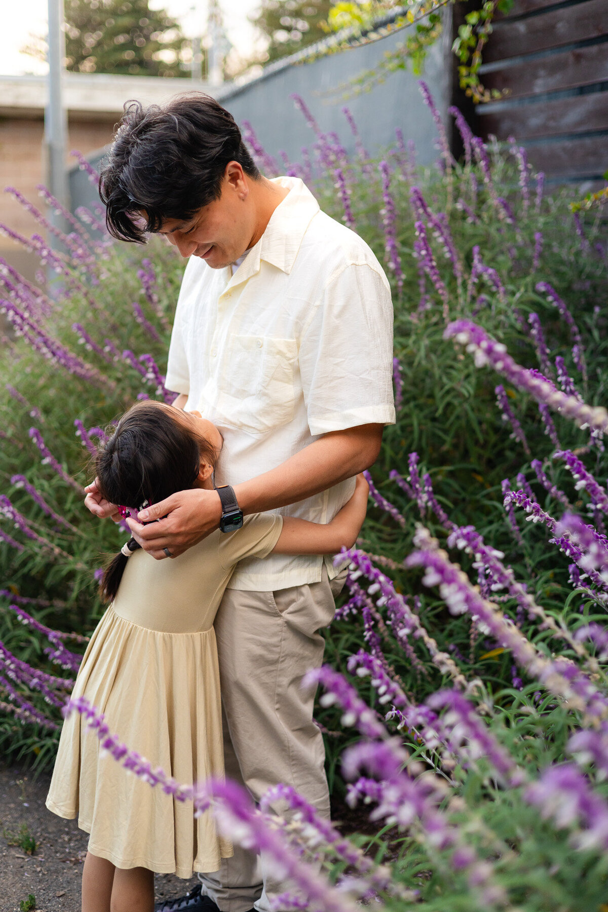 Quiet embrace between father and daughter in garden setting – Bay Area Family Portfolio - Ellobelle Photography Family Photographer