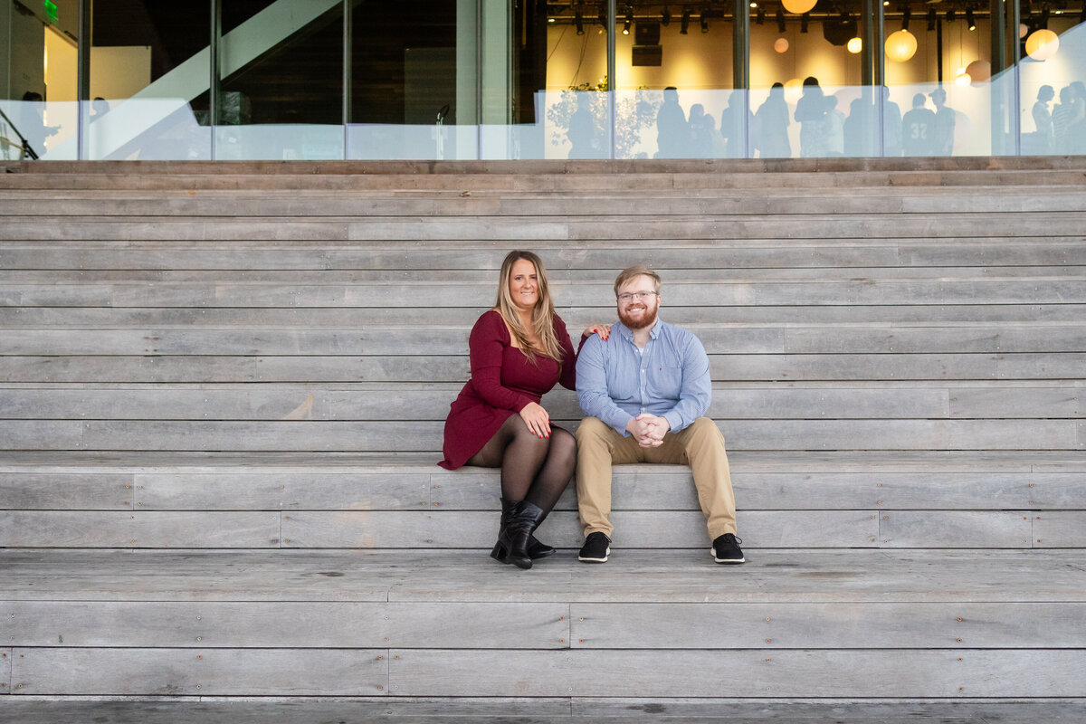 city-engagement-couple-on-steps-of-ica-seaport-lisa-gilbert-photography