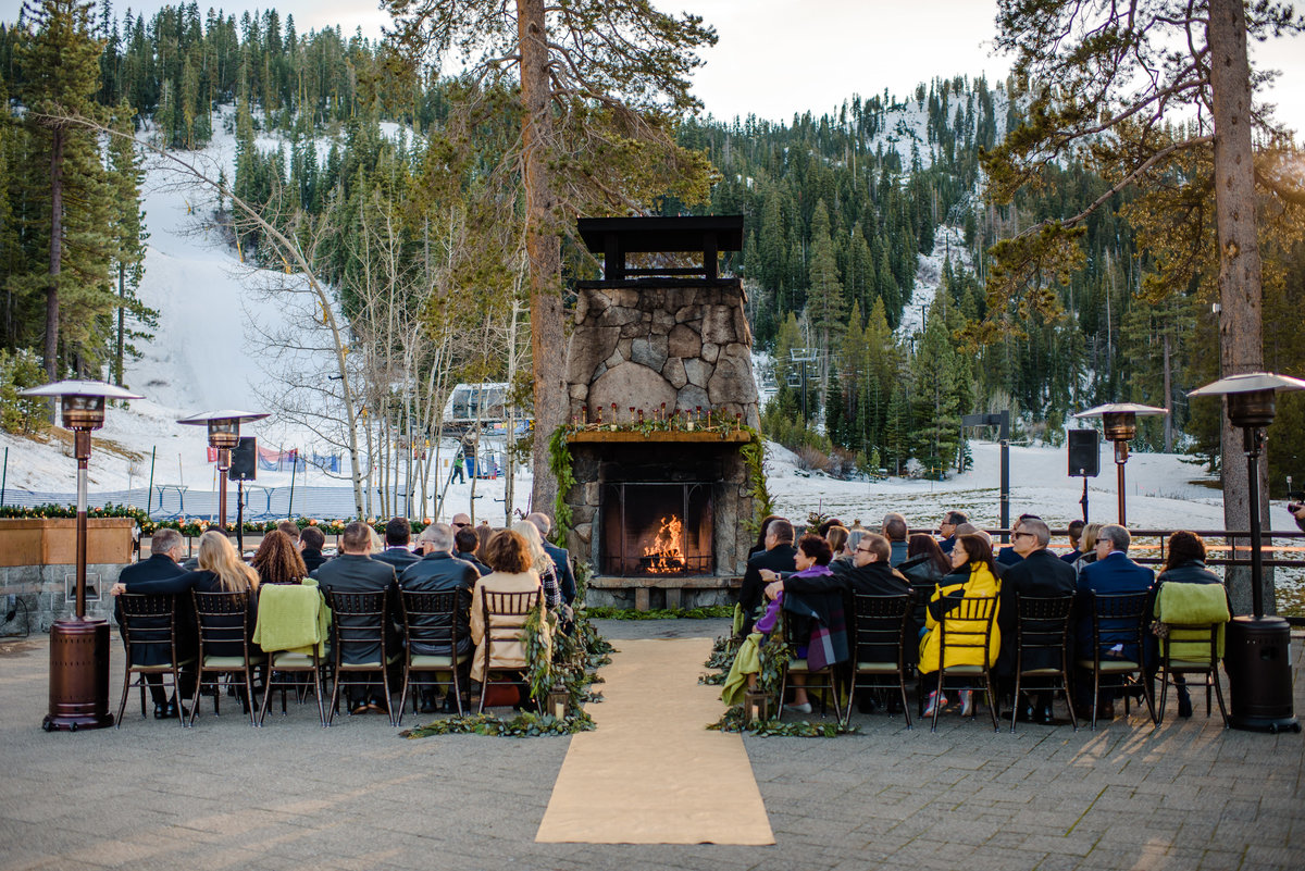 Lake Tahoe Wedding Planners couples wedding ceremony at outdoor fireplace in snow at venue The Resort at Squaw Creek, Lake Tahoe, Joy of Life Events image by Charleston Churchill 3