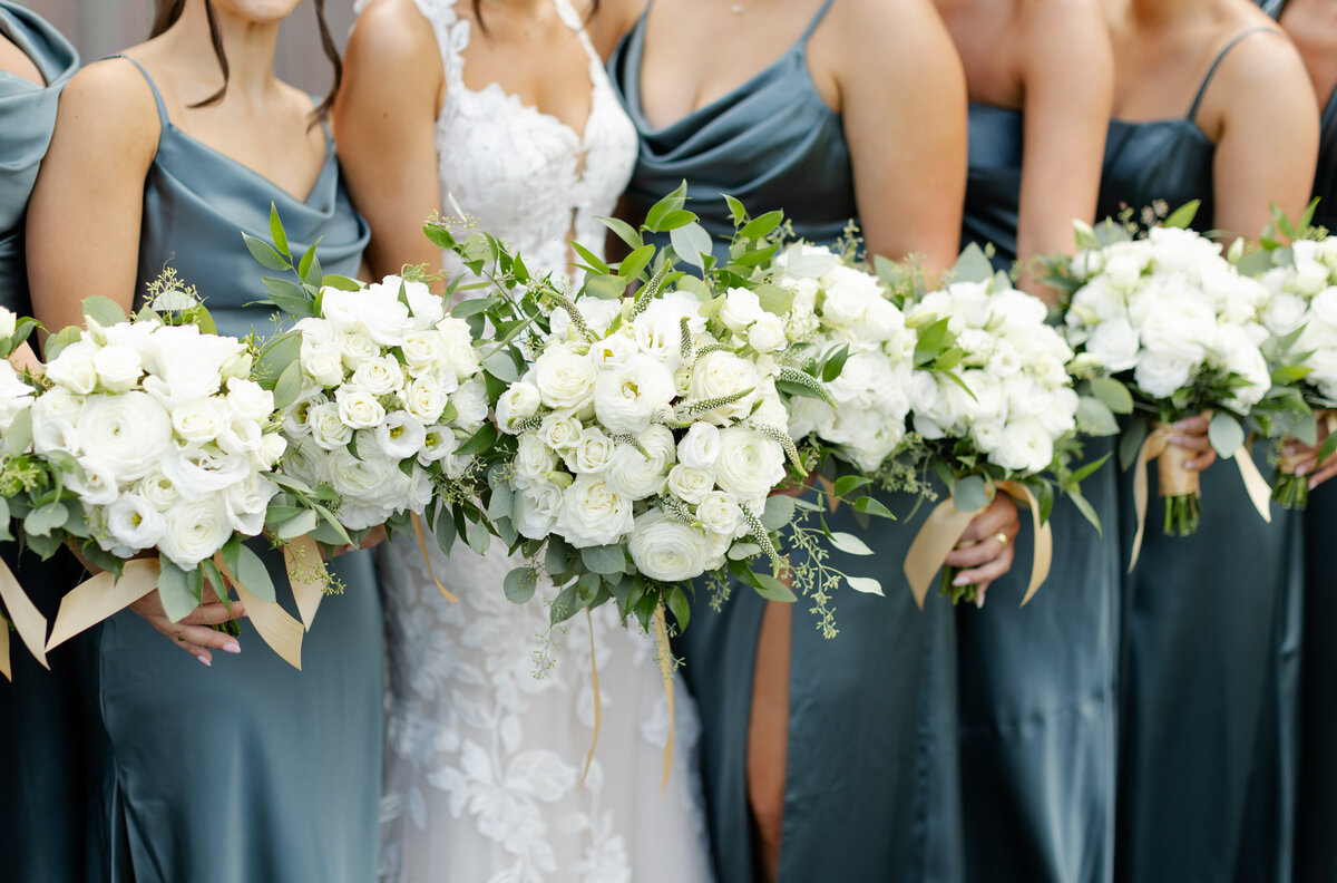 Close up of bridesmaids holding their boquets