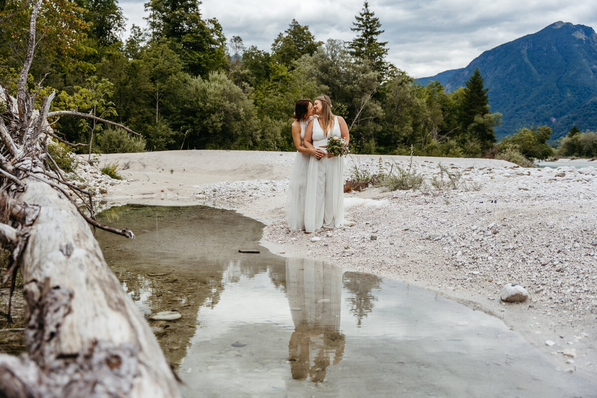 romantic couple in Soča Valley river elopement