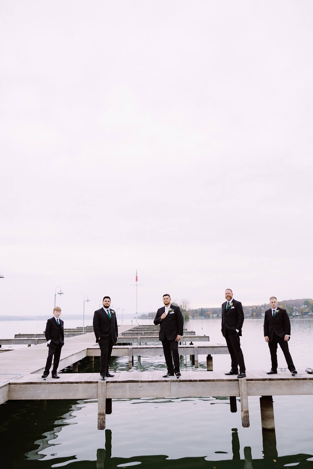 Groomsmen standing on the dock at The Lake House on Canandaigua, Finger Lakes, NY
