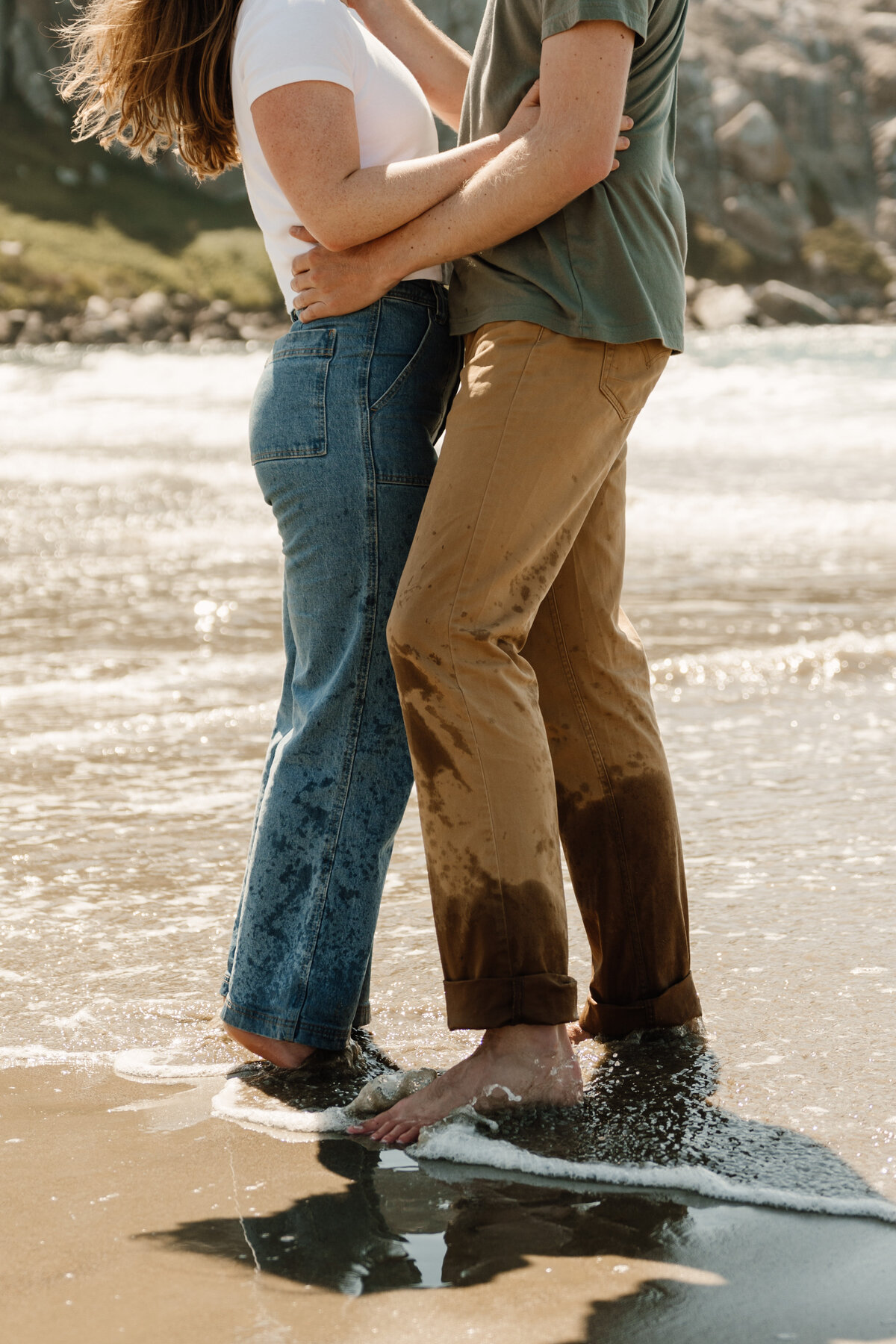 couple playing in ocean in morro bay
