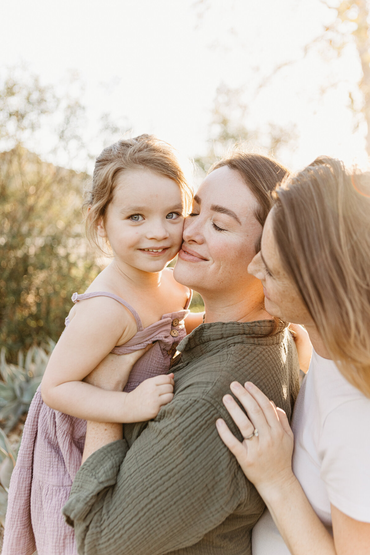 Family hugging at golden hour in Burbank.