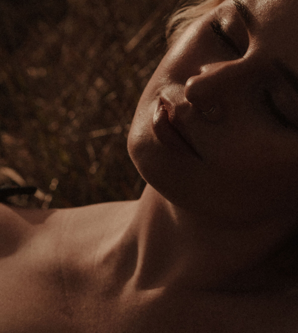 close up of woman's golden skin during sunset photoshoot in Bend, Oregon