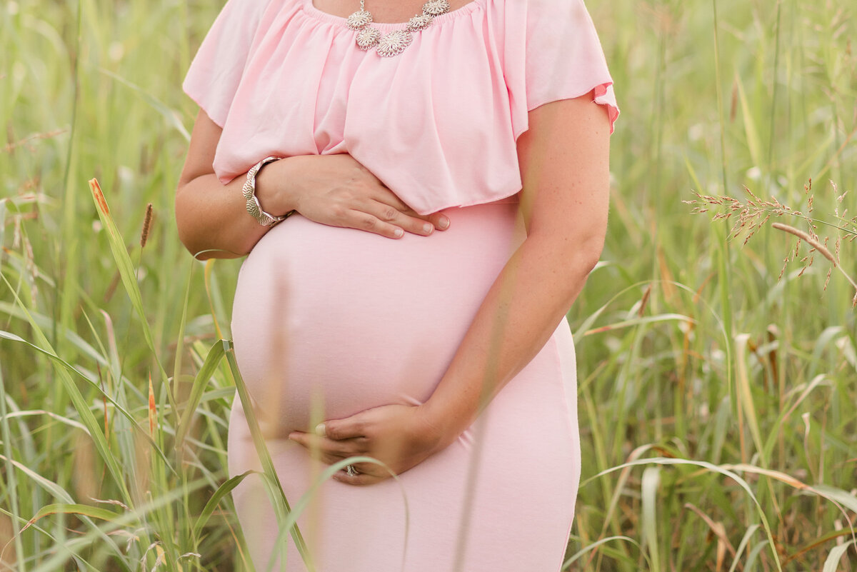Maternity Session with long pink dress at a park by Michelle Lynn Photography located in Louisville, Kentucky