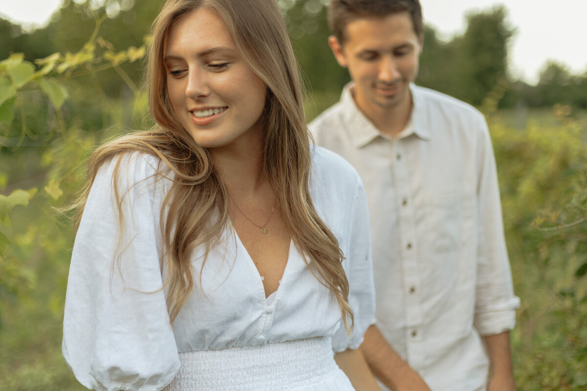 Intimate winery picnic session with lush palm trees and bright natural light

