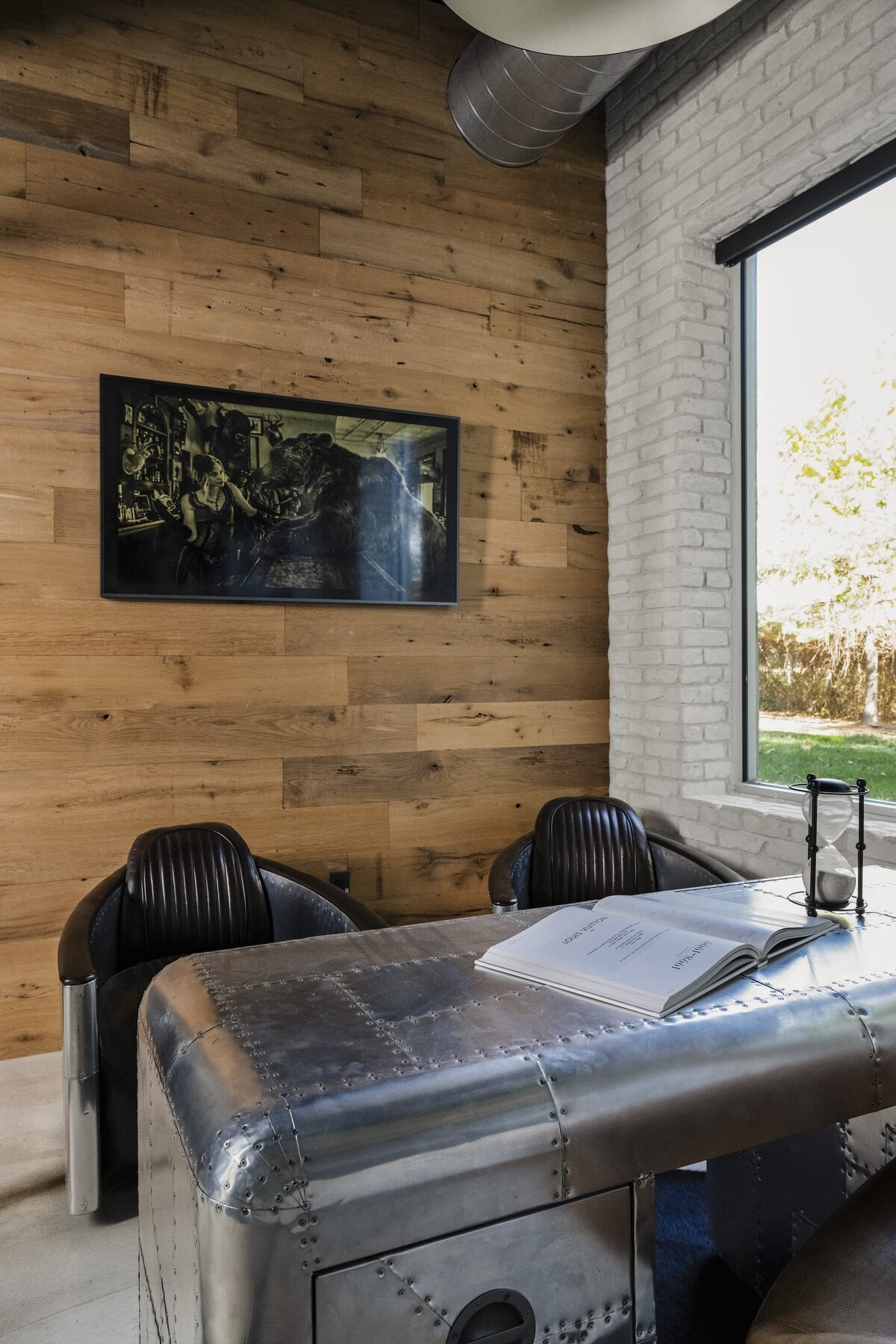 candra lynn interiors old bridge project floor to ceiling wooden wall with metal office desk and large windows