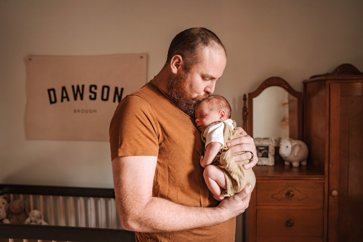 dad holding baby boy