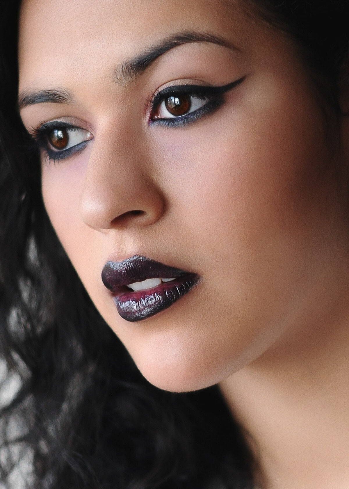 High-fashion makeup with metallic shadow and wet-look skin – styled by Lyds Makeup for a photoshoot in the New York City area.