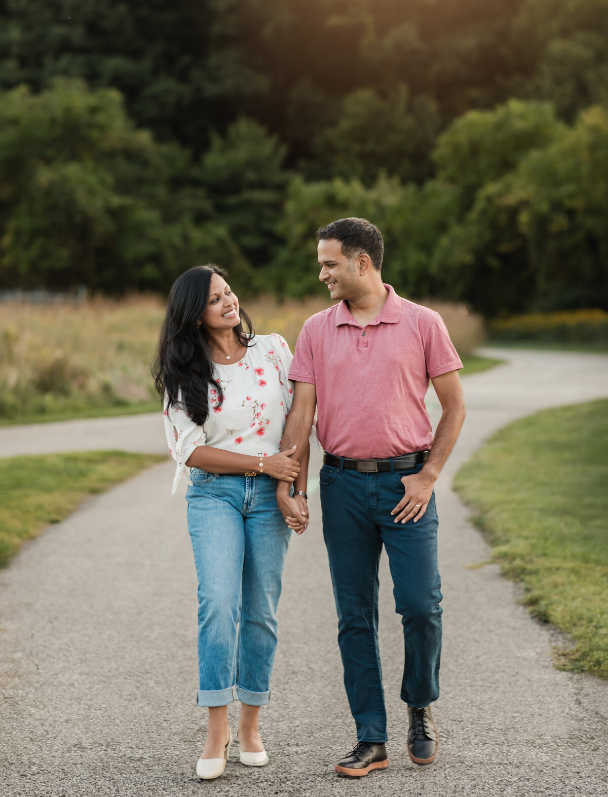 husband and wife walking in park for family photos cleveland family photography