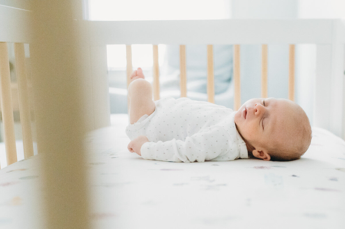 newborn baby in a crib