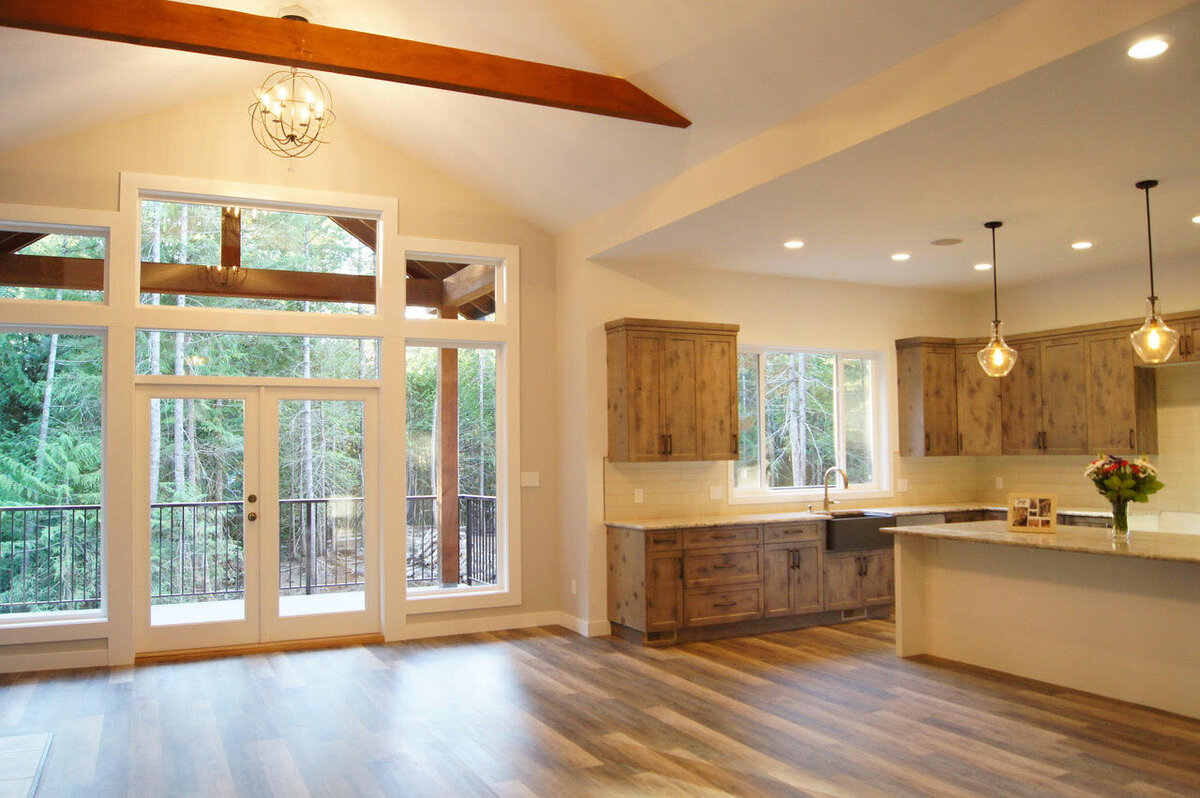 Rustic kitchen design with vaulted ceilings and wood beams.