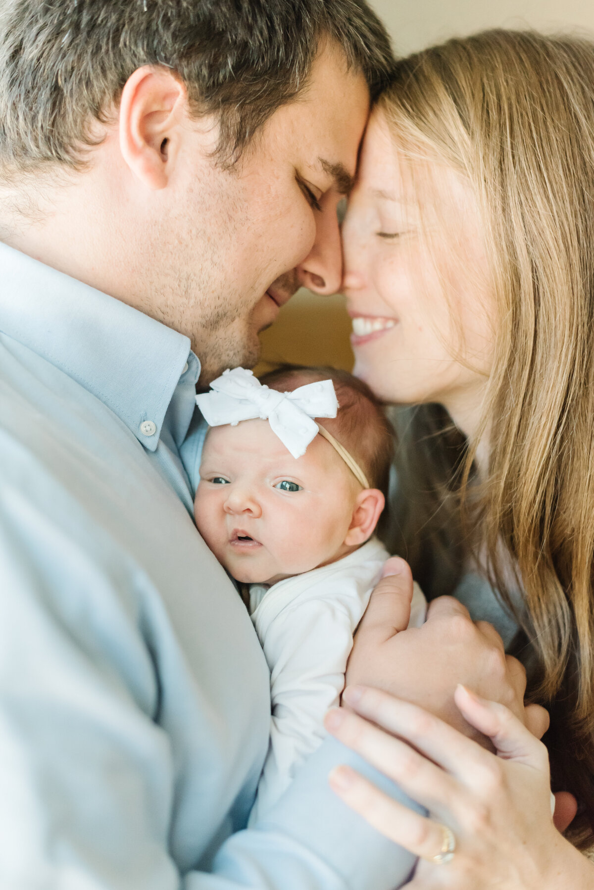 Parents snuggling newborn baby girl - Northern Virginia Newborn Photographer