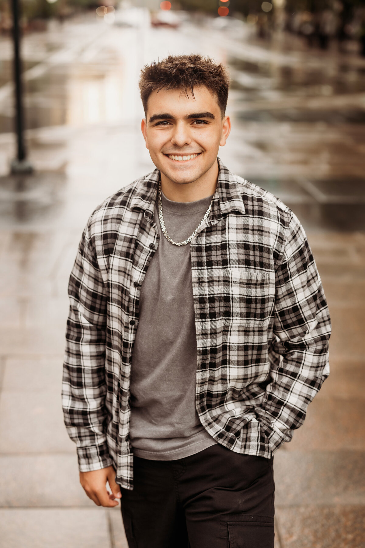 High School senior boy posing in downtown Denver for an urban senior portrait session