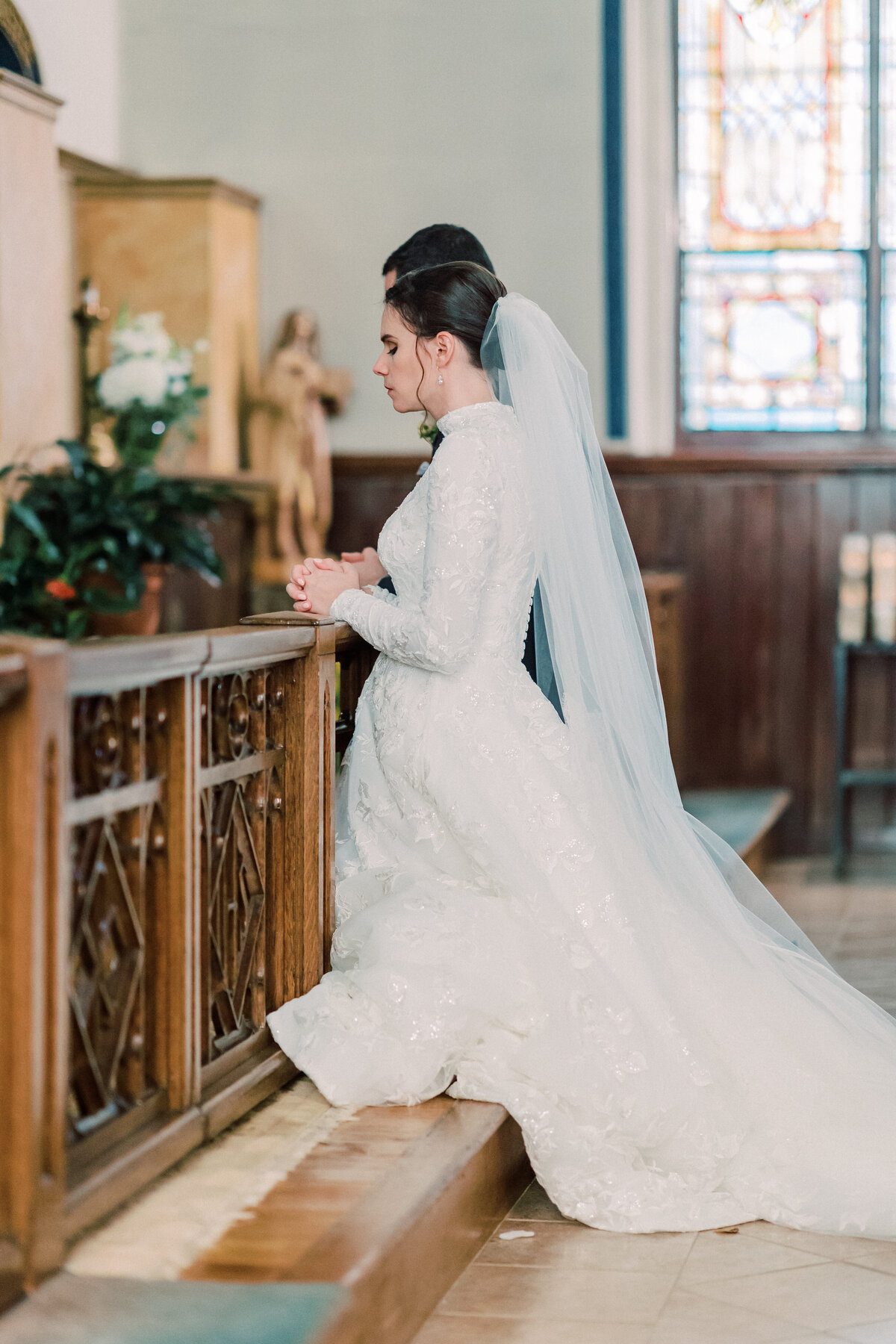 Couple praying at altar during Shrine Chapel Blessed Sacrament Traditional Latin Mass wedding