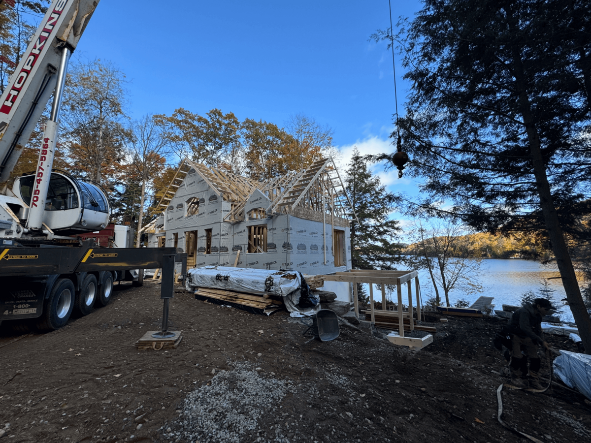 High-end custom home project in Haliburton Highlands with unique exterior finishes and handcrafted elements.